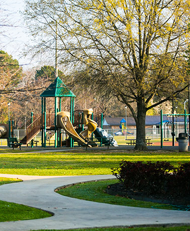 A children's playground with slides, tunnels, and other features in a park in Priceville, AL.